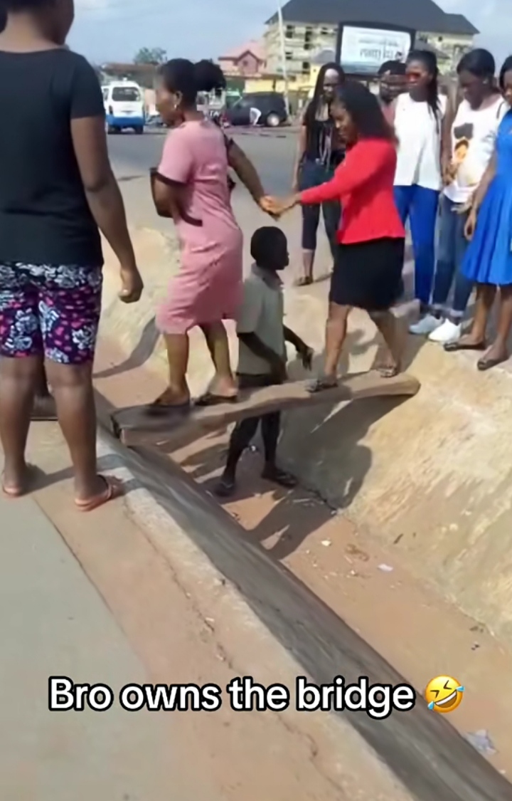 Drama as boy demands money from folks crossing his 'bridge'