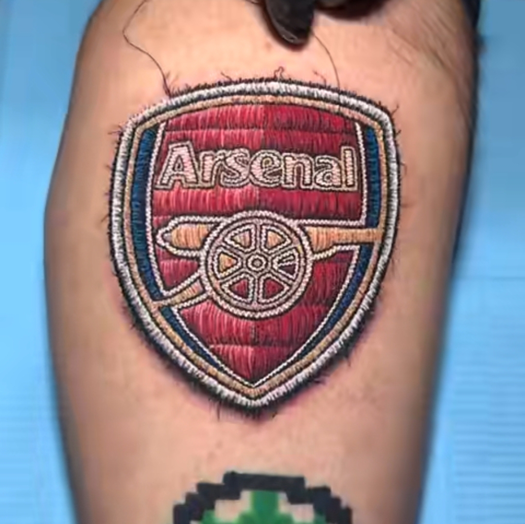 Arsenal fan takes loyalty to extreme, stitches club logo onto skin with needle and thread