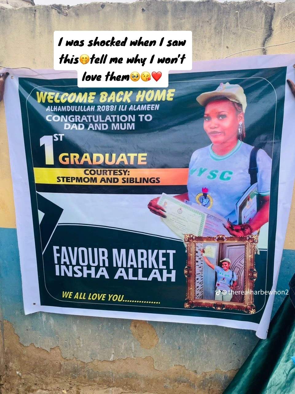 "First graduate" – Family sets up huge banner as their daughter completes NYSC