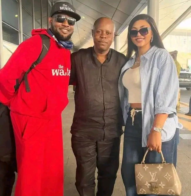 Regina Daniels, her father and AY Makun at an airport 