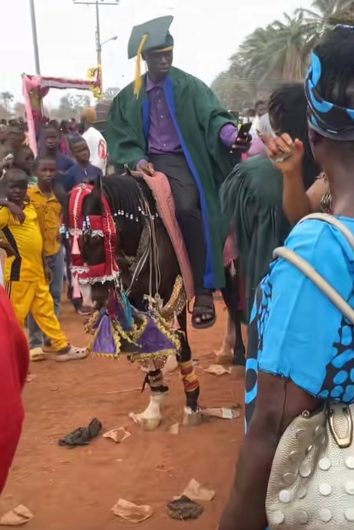 Moment fresher storms his matriculation on a horse