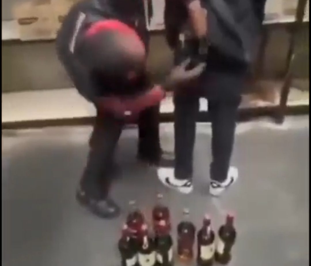 Couple caught on camera stealing drinks worth ₦5 million by hiding them in their clothes