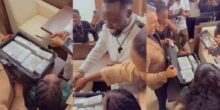 Man slices real cash in place of a cake on his birthday